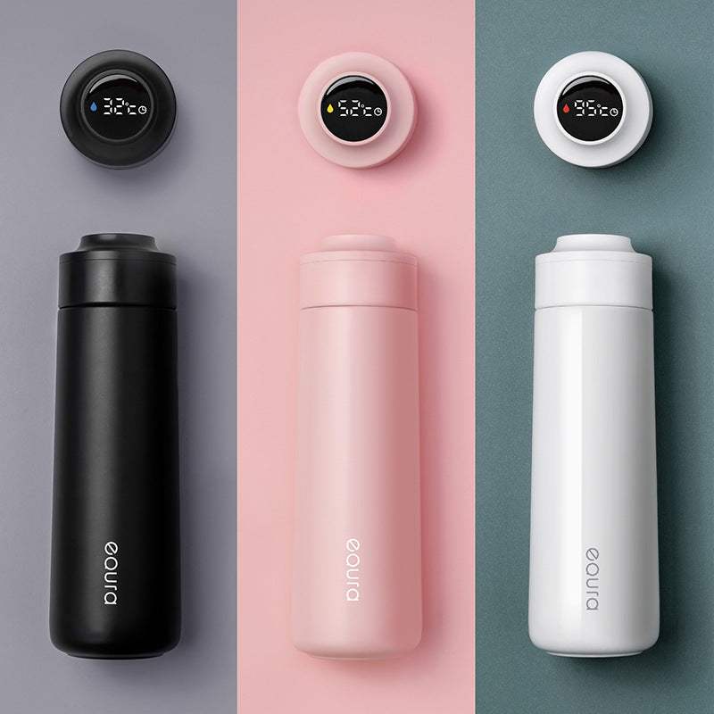 Smart insulated outdoor water bottle in white, black, and pink with USB charging and 400ML capacity