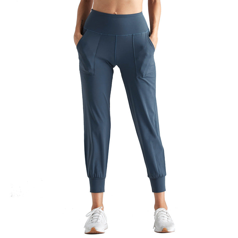 Woman wearing Fitness Capri Yoga Pants in dark grey for active yoga practice