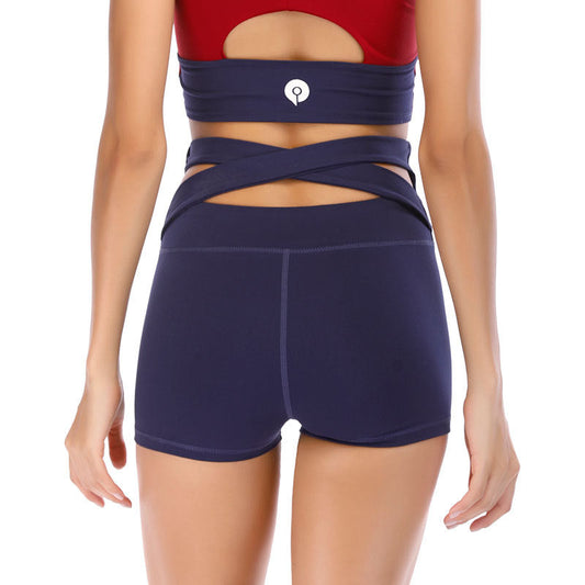 Woman wearing high elastic cross fit shorts in navy, designed for quick dry and muscle support during workouts