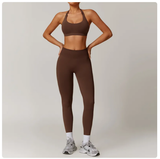 Woman wearing seamless backless yoga set with bra and leggings in minimalist solid color for workout