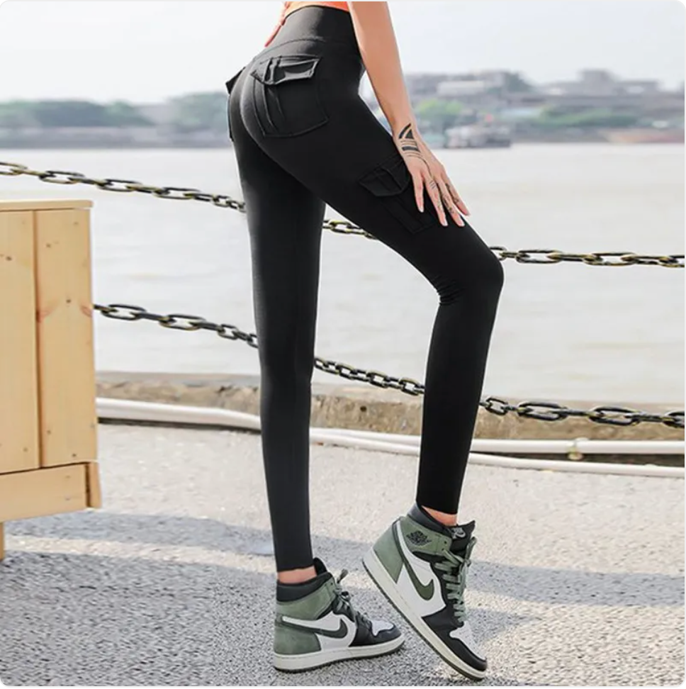 Woman wearing high waist leggings with scrunch butt and pockets for workout and yoga