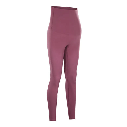 Pregnant woman wearing nude maternity yoga pants for comfort and support during yoga and daily activities