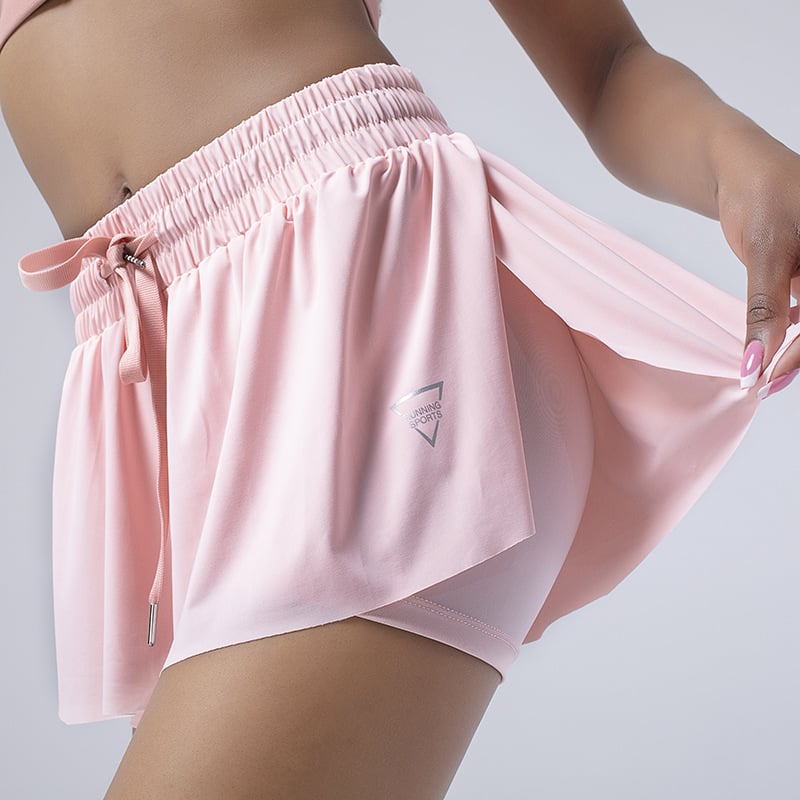 Women wearing colorful yoga fitness tennis running exercise shorts during workout session