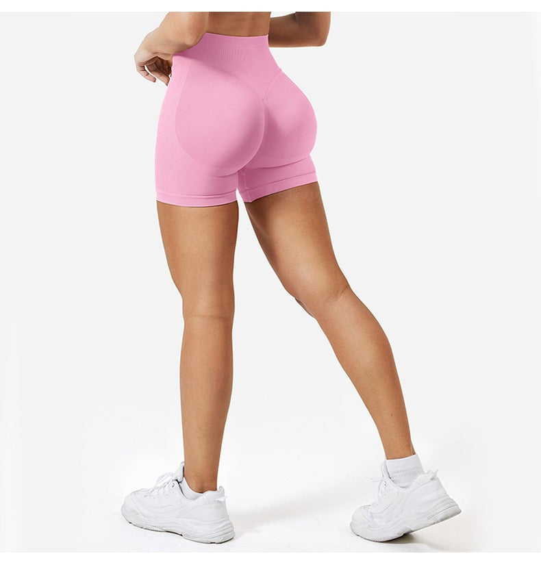 Woman wearing high-waist seamless yoga pants in multiple colors for workout and yoga sessions